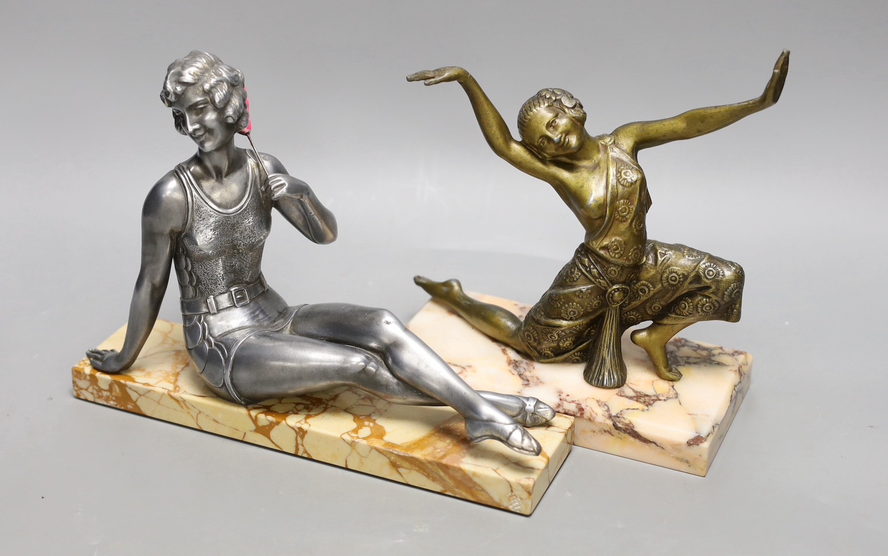 An Art Deco ‘bathing beauty’ metal figure on stand and another of a female dancer on marble stand, ‘bathing beauty’ 25cms wide